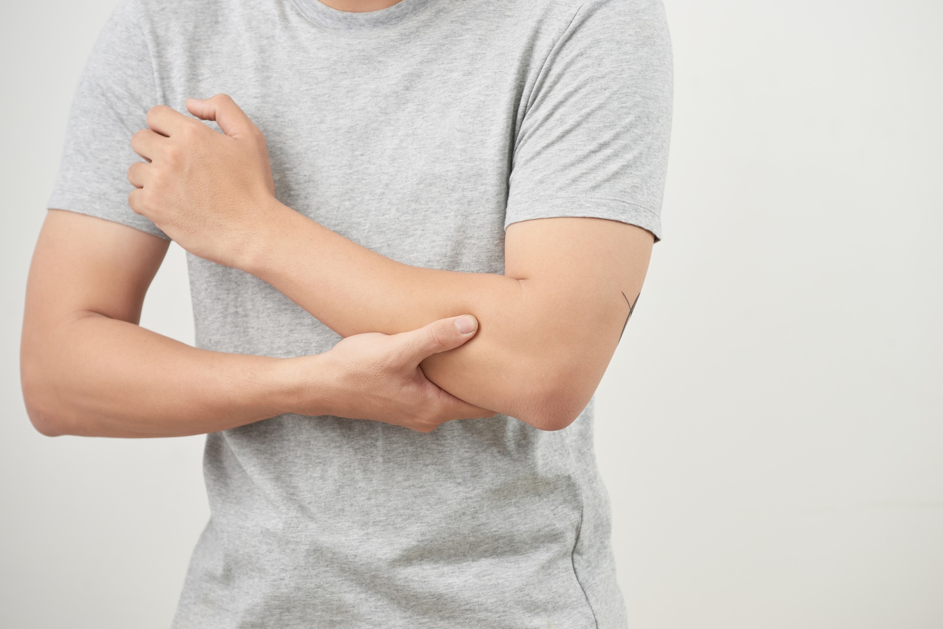 Arms pain. Man suffering from painful feeling in arm muscles. health concept